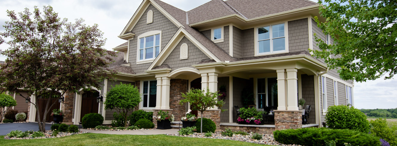 The front of a big modern house.